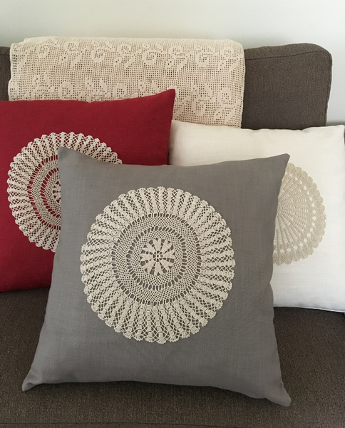 Gray linen cushion with crochet doily on sofa - Shopping Blue